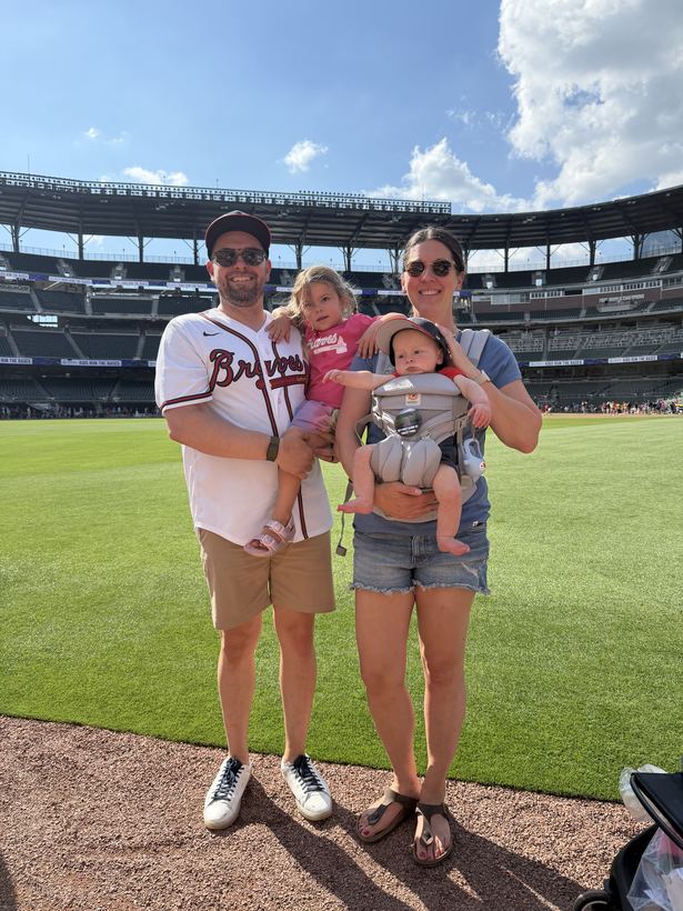 James with his wife and two kids on the field at Truist Park